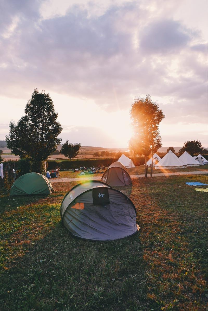 a 4 person pop up tent in the middle of other tents