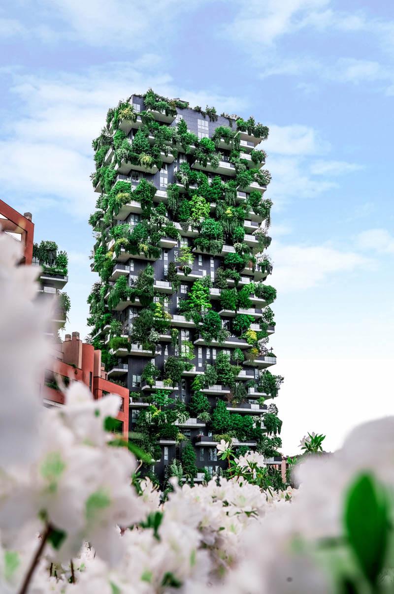 a green skyscraper in milan