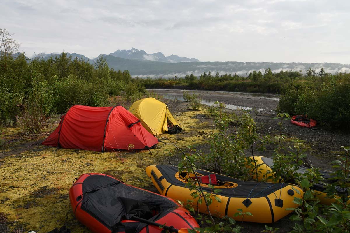 a red 4 person tunnel tent next to a yellow tent