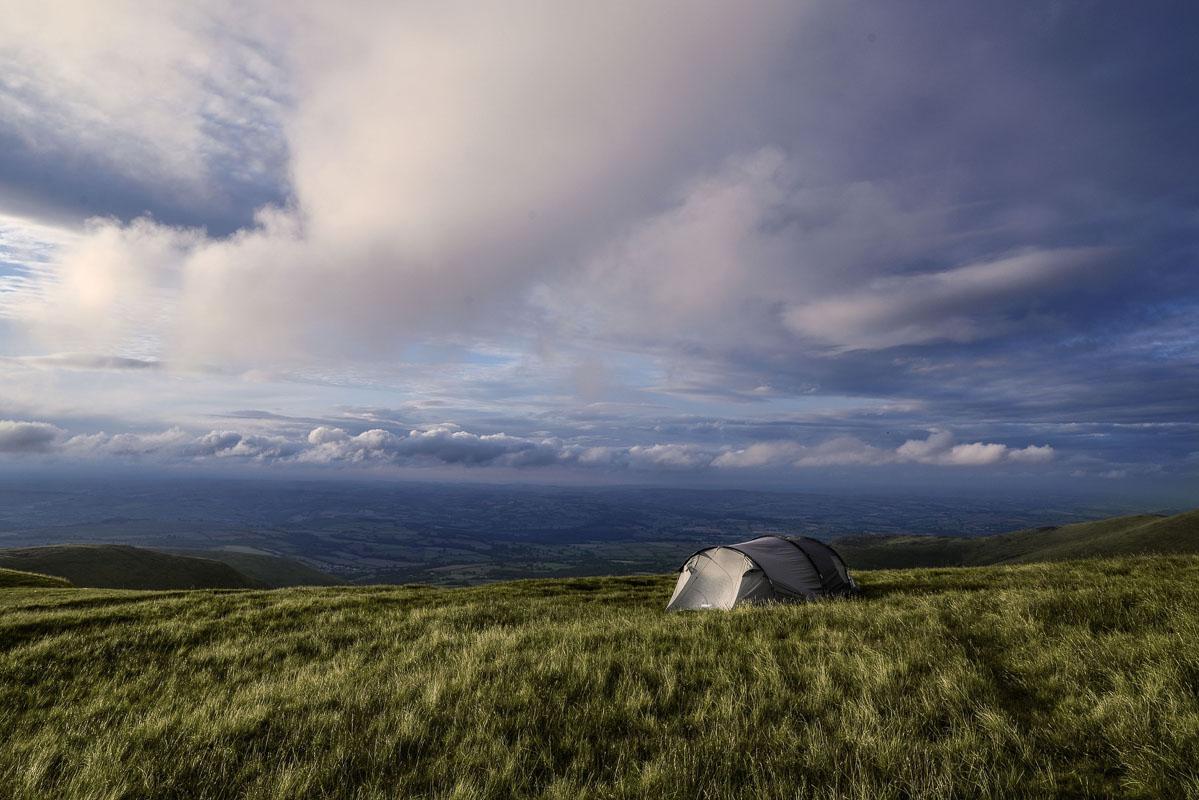 a white 4 man tunnel tent on the high fields