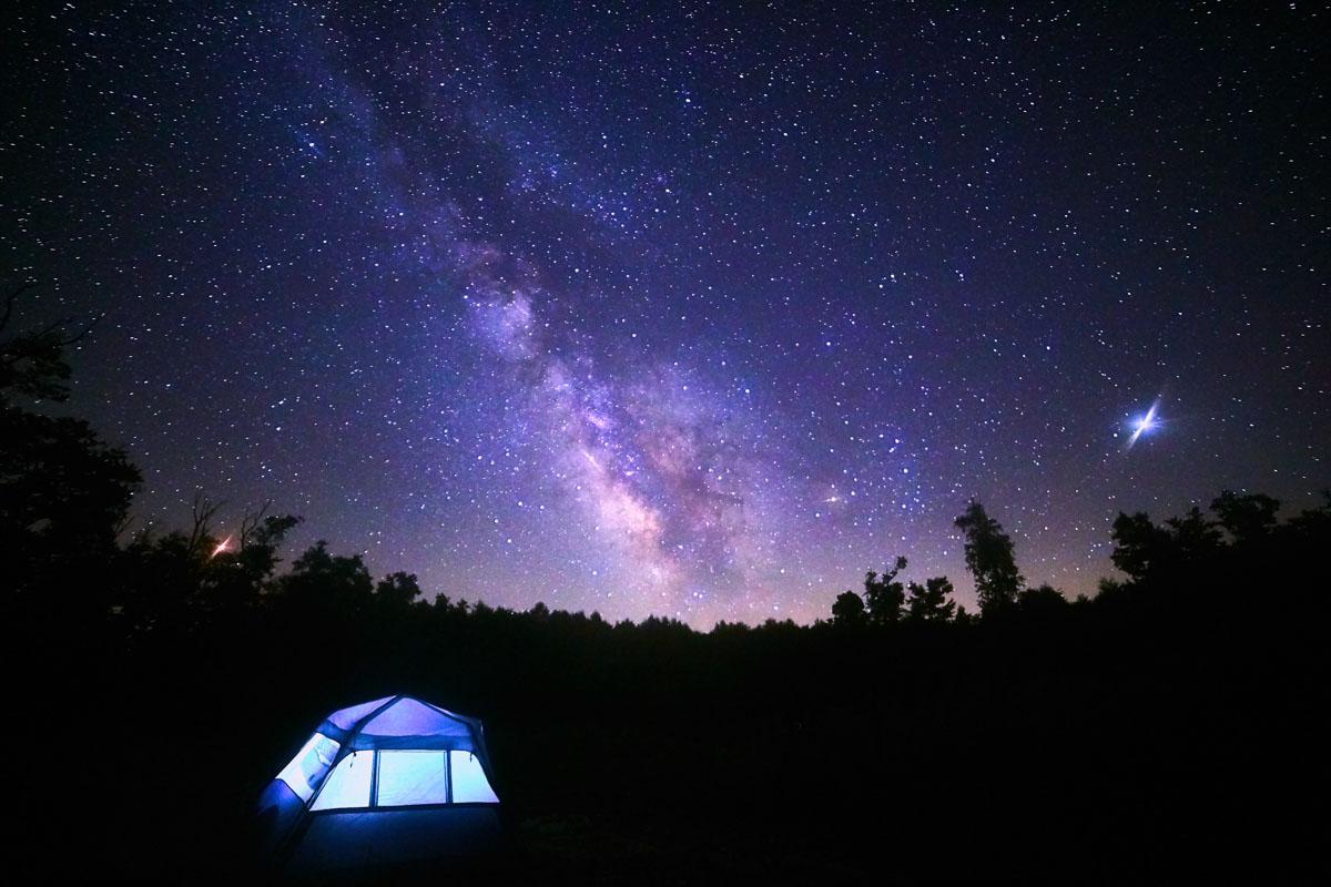 blue tent under the milky way