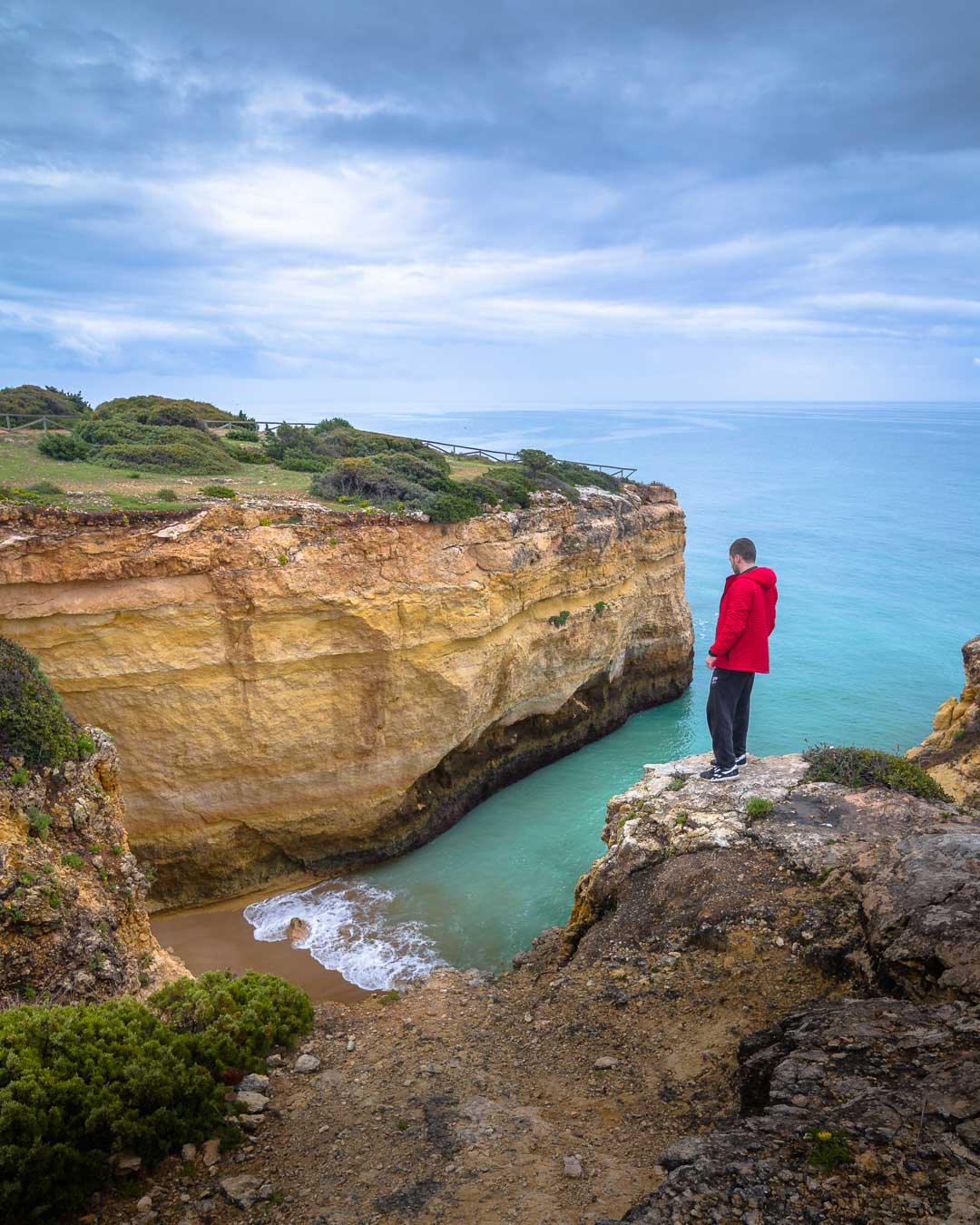 standing over cao de raivoso beach