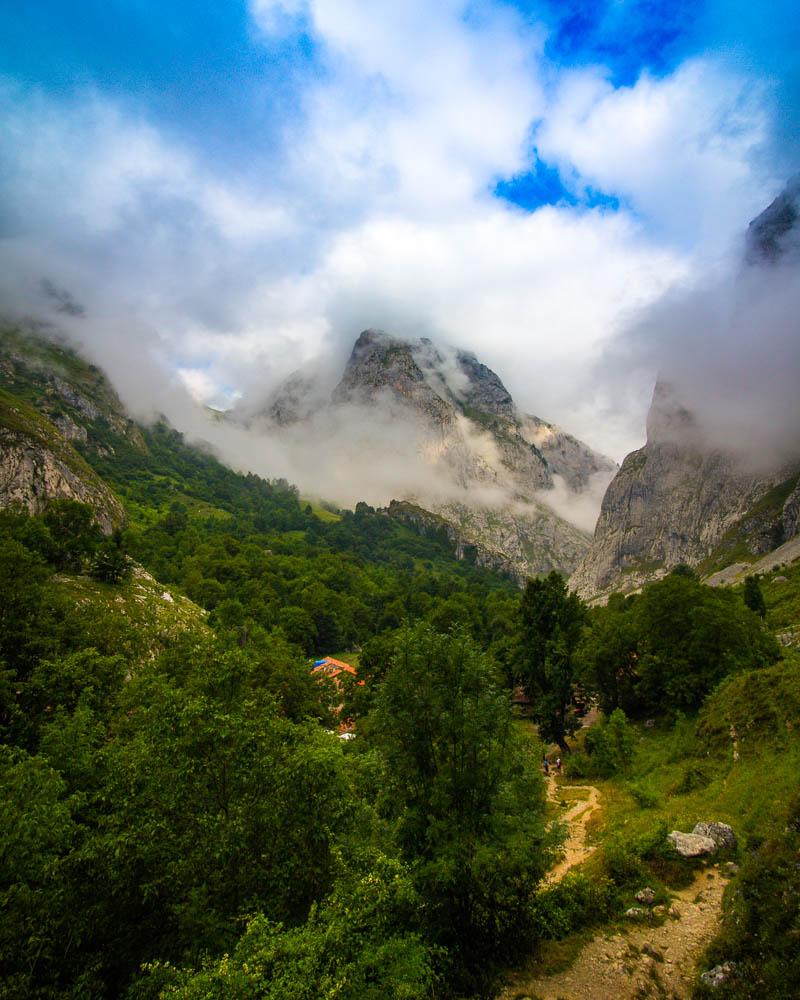 resting on the hike to sotres and looking back to bulnes