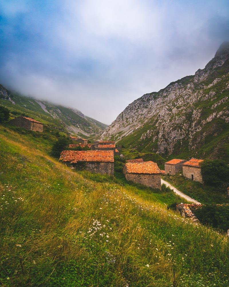 the abandoned stone huts below sotres vertical version