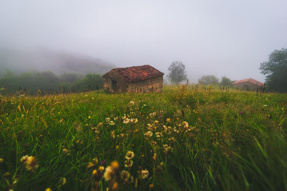 mountain hut under fog in sotres