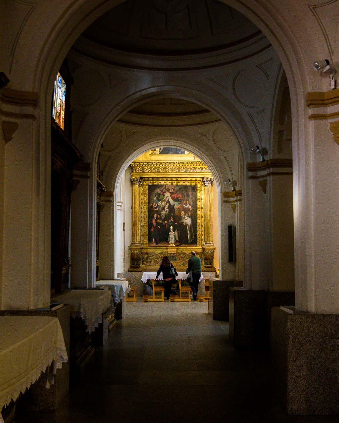 side hall leading the massive painting in iglesia santa teresa de avila spain
