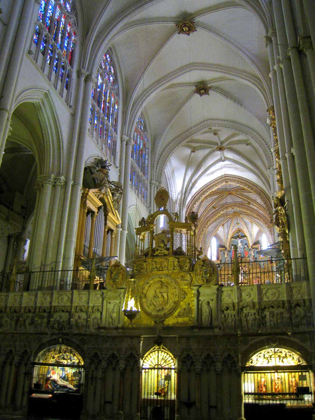 inside the toledo cathedral with stained glass windows