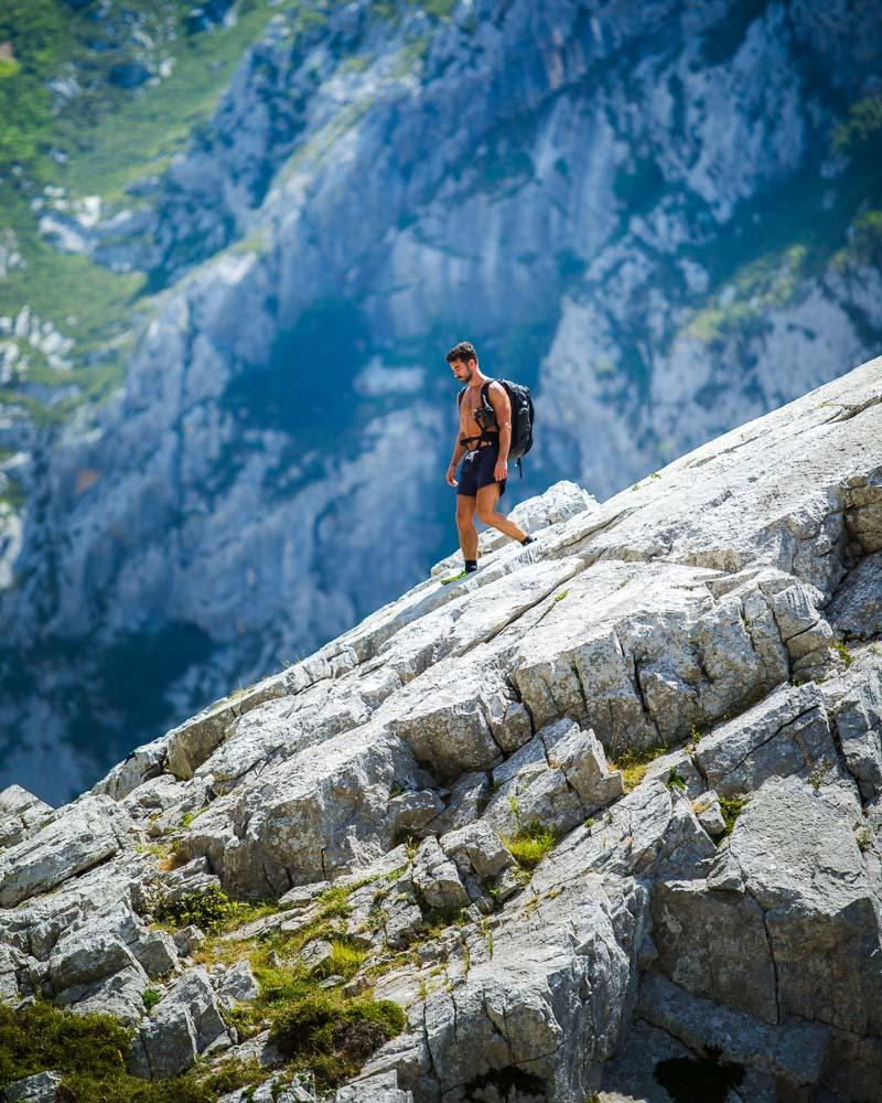 laurent climbing down a rock