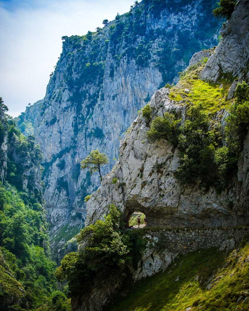 path going through a hole in the rock