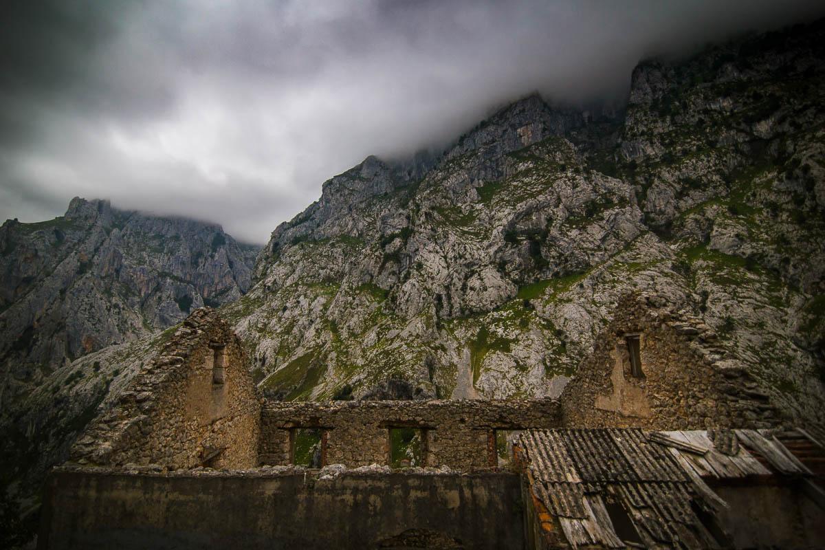 ruins of a mountain hut under the fog