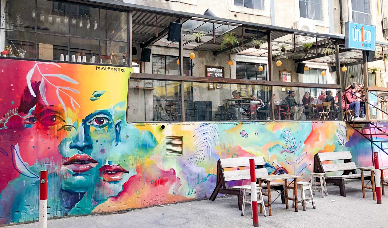lx factory in lisbon with colorful mural