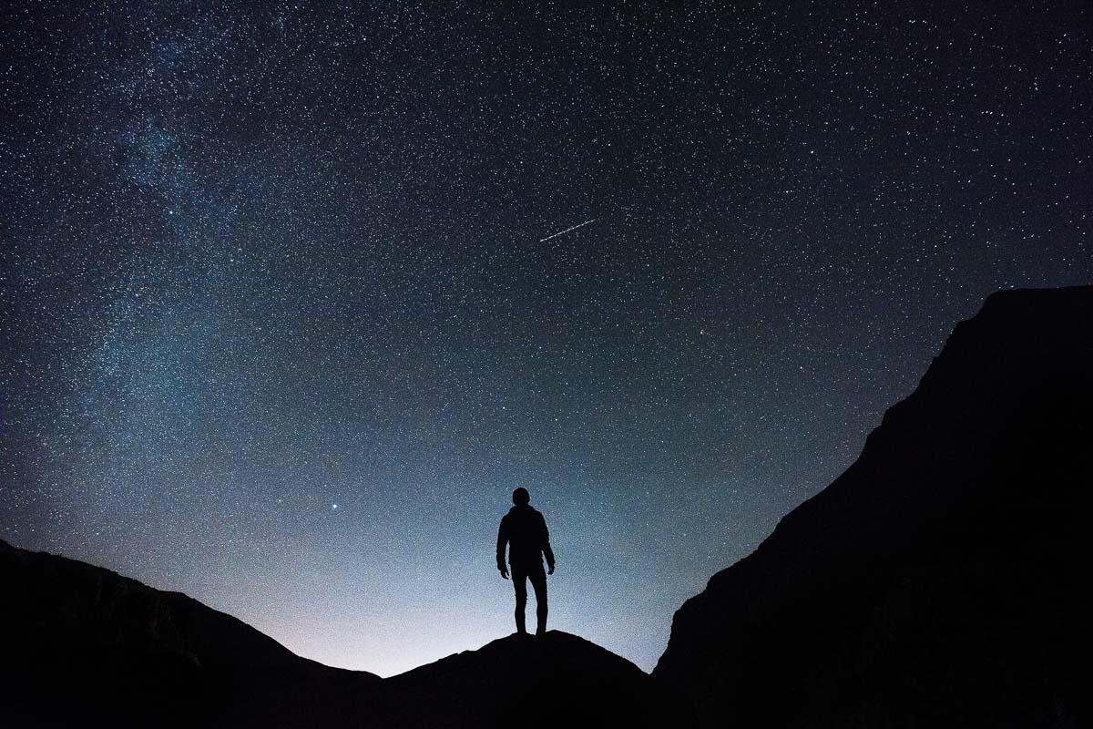 man enjoying night hiking and watching the stars on a clear night