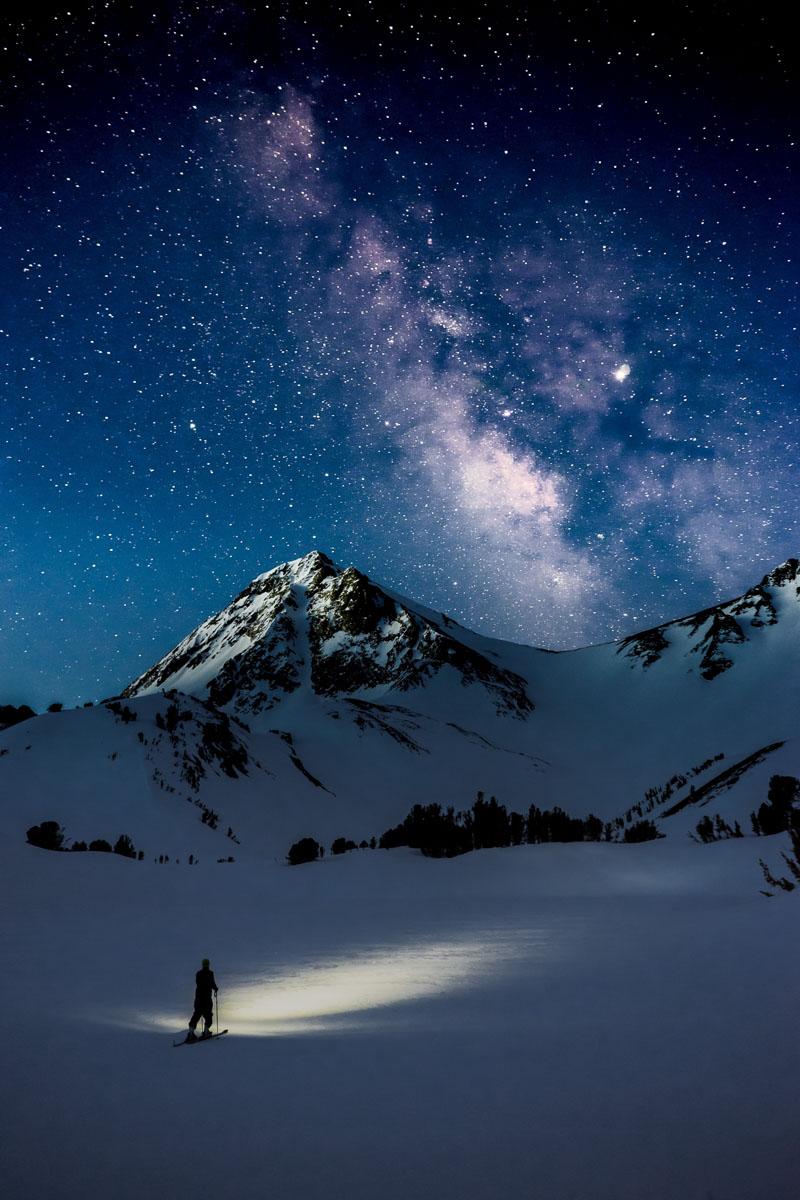 man on skis at night under the milky way