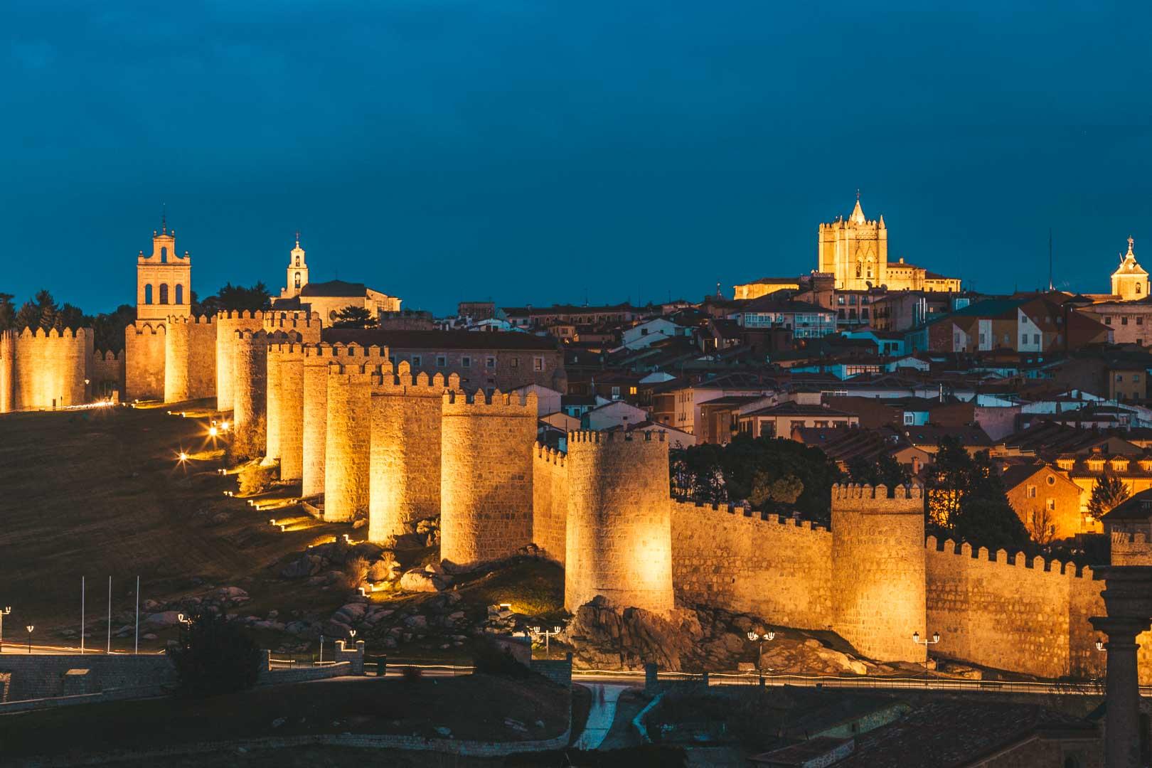 the walls of avila at night from the mirador cuatro postes avila