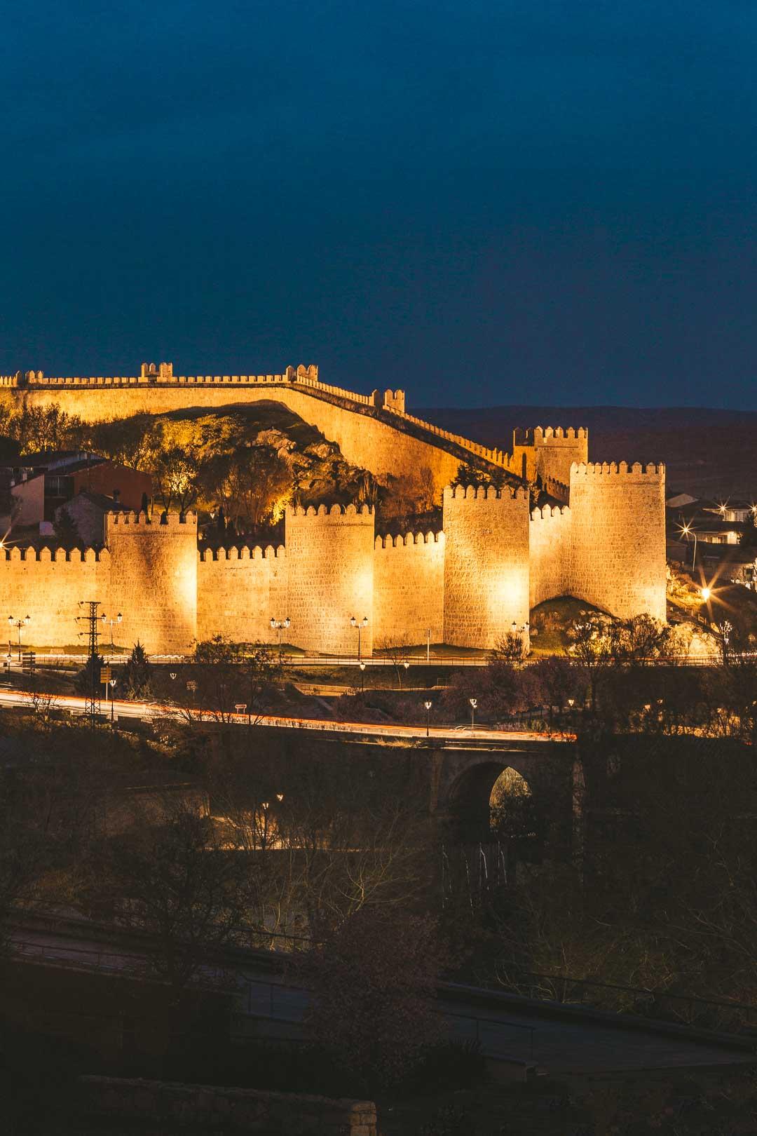 walls of avila and towers at night