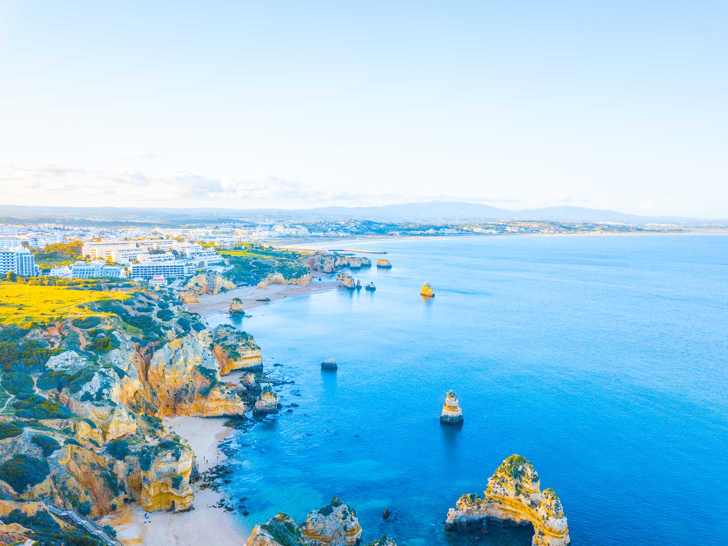 panoramic view over praia do camilo portugal