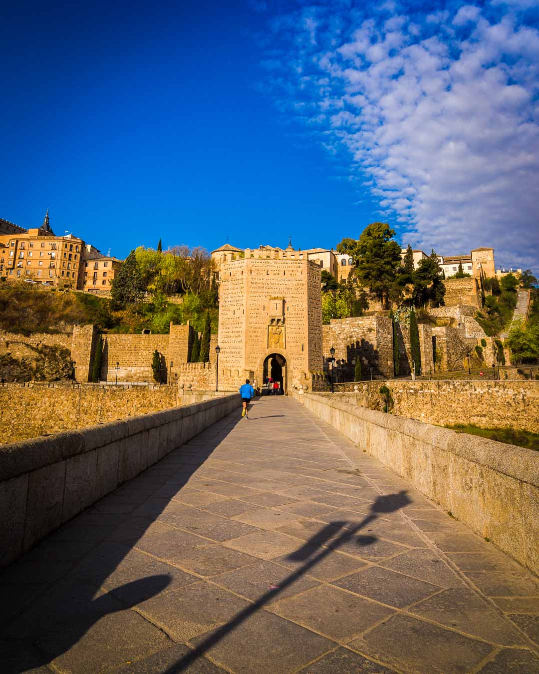 crossing the alcantara bridge toledo