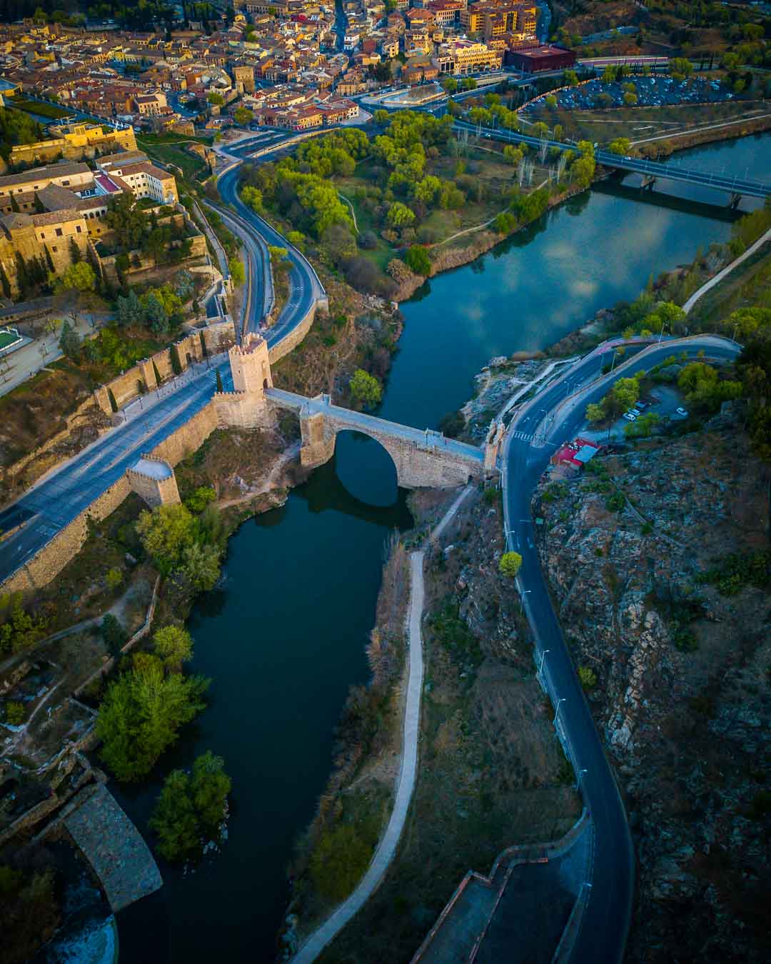 aerial view of the puente de alcantara last stop on the toledo tour