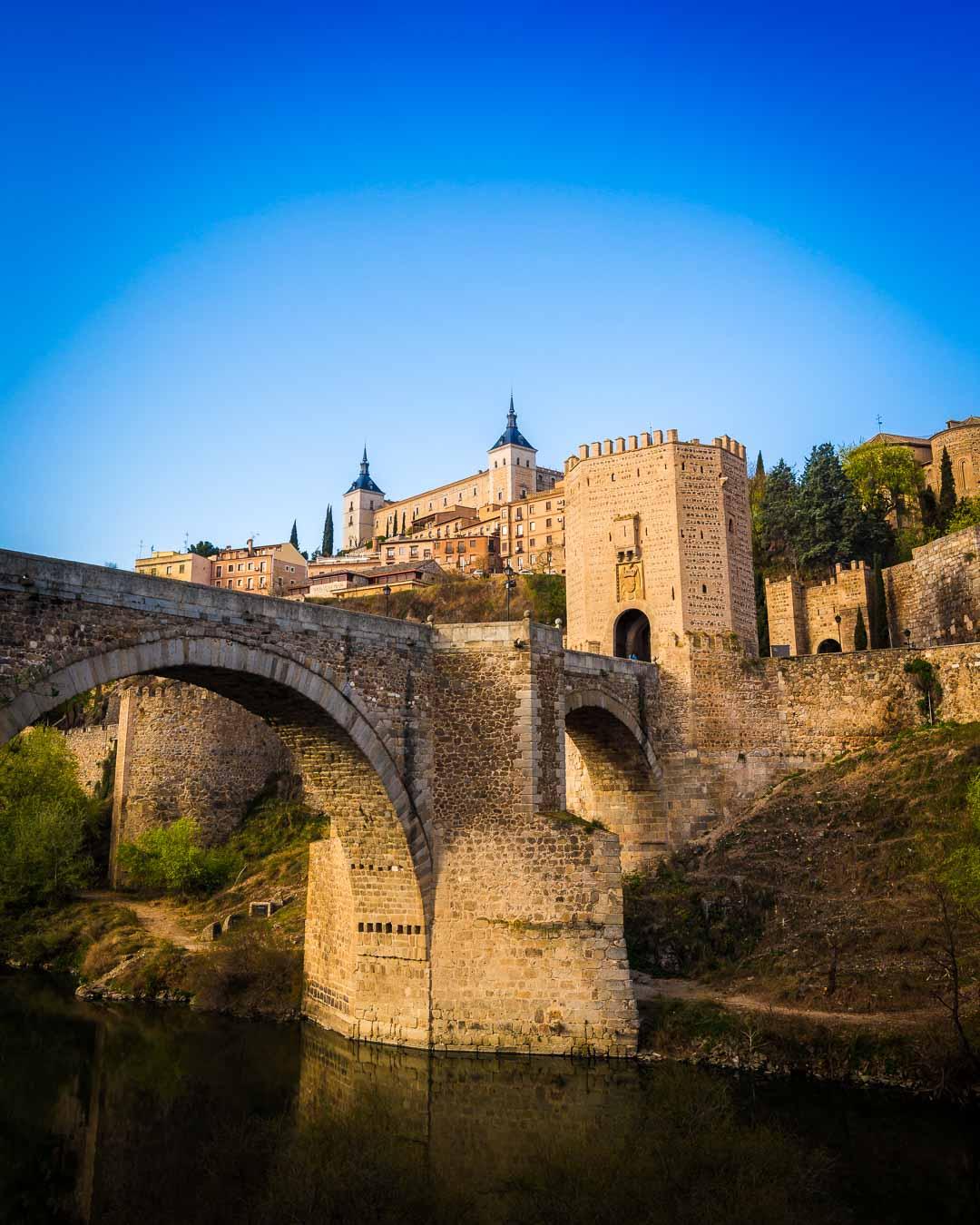 el alcazar de toledo above el puente de alcantara