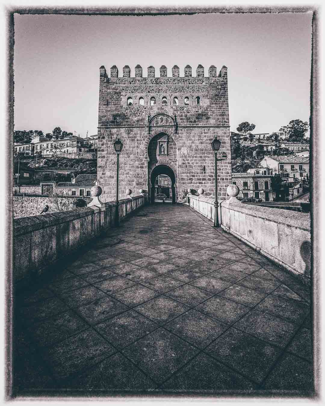 eastern tower of the puente de san martin in black and white