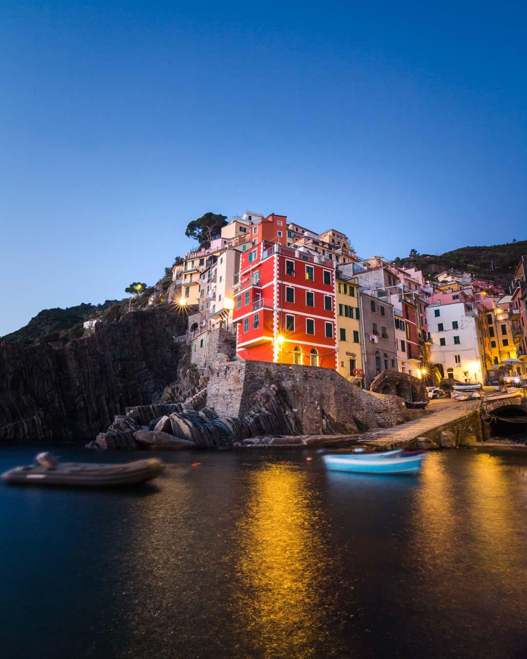 riomaggiore from the harbor at night