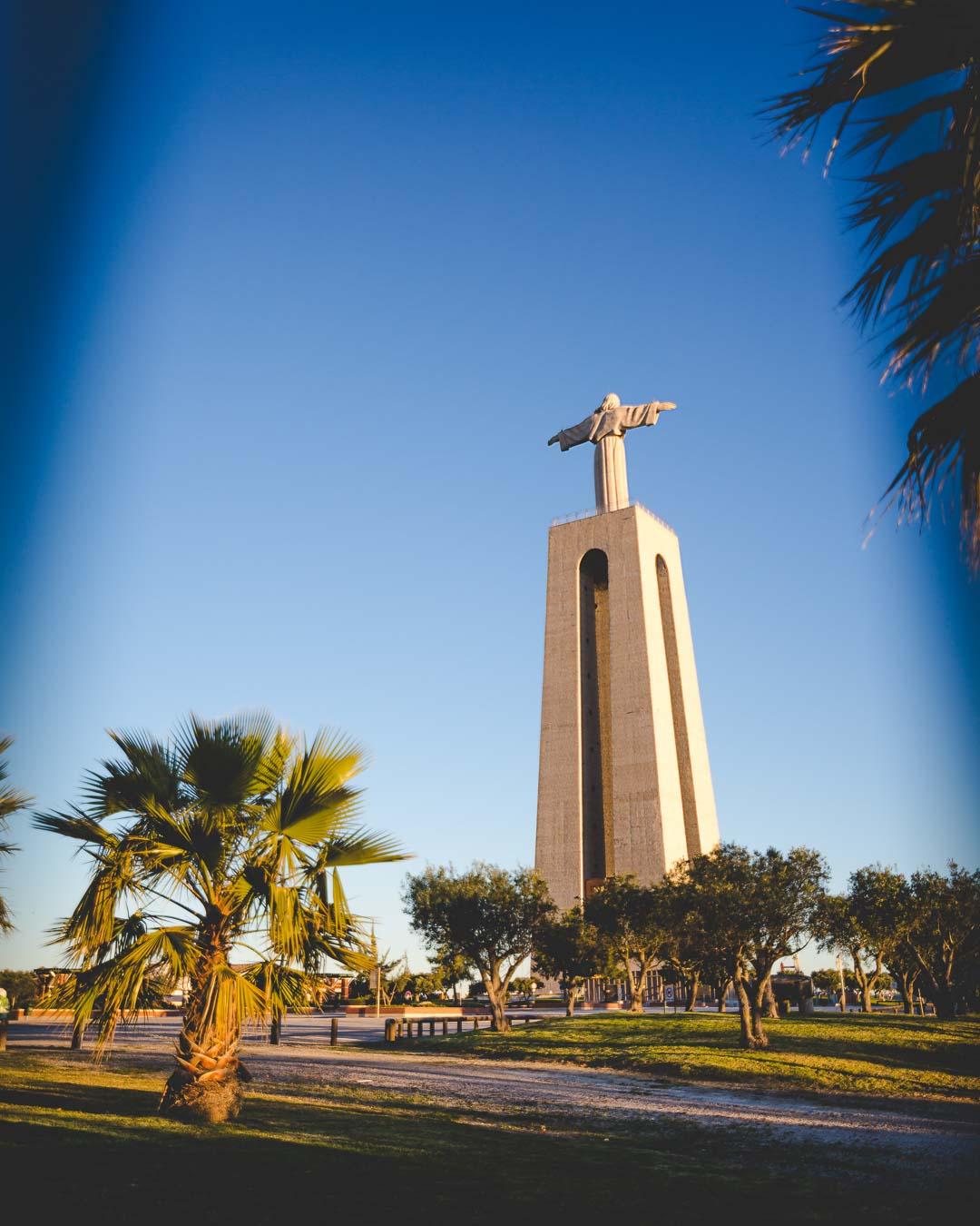 cristo rei above the palm trees