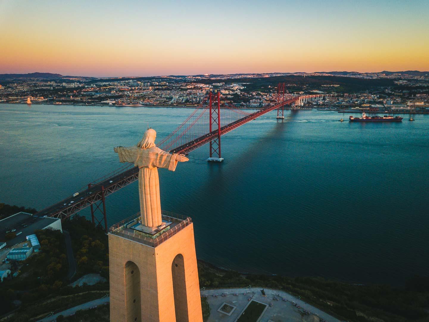 cristo rei lisboa next to the 25 de abril bridge