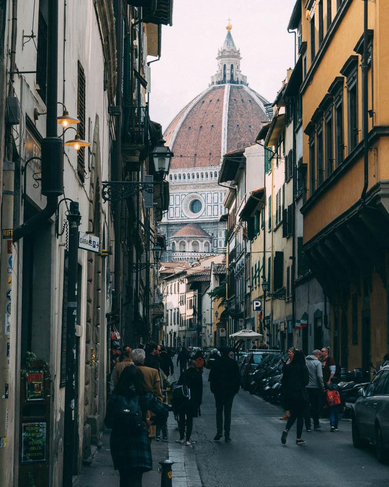 street in florence with view of the cathedral