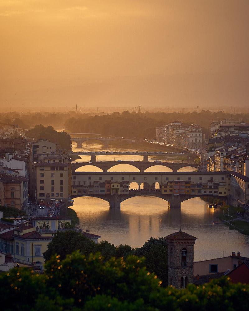 sunset over the ponte vecchio in florence italy