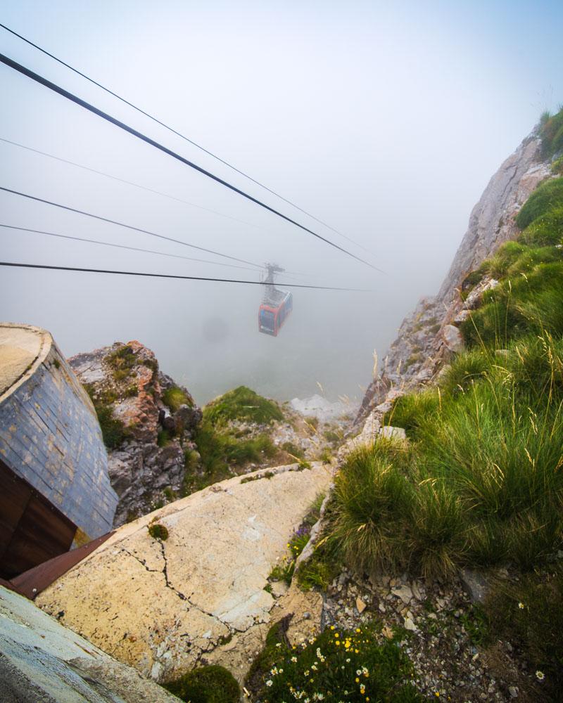 cable car descending into the fog