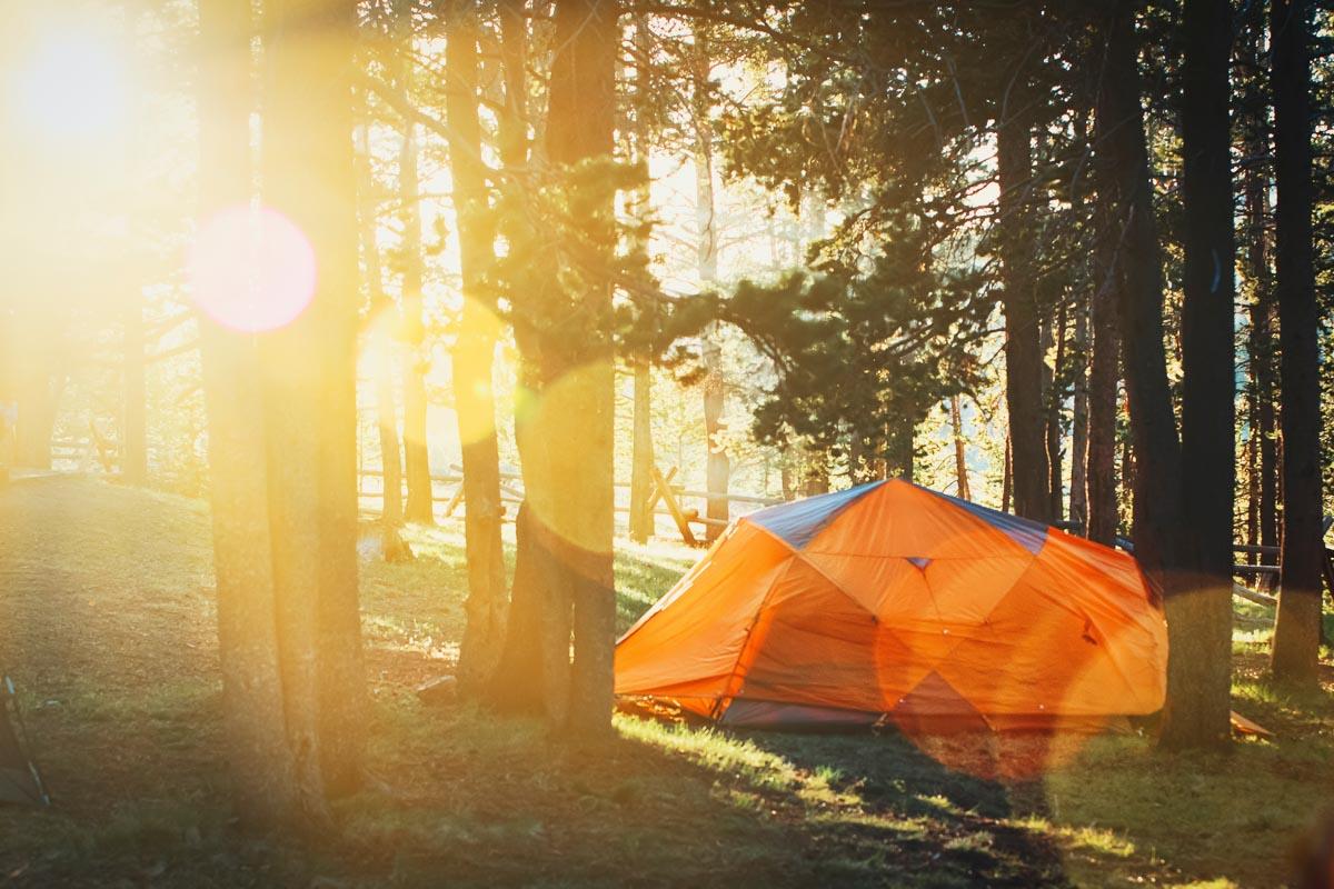 an orange best four person tent at sunrise