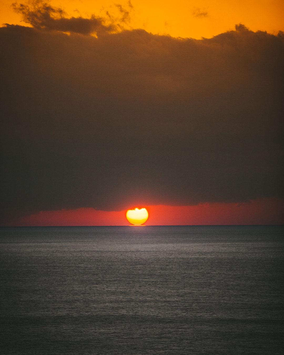 the sun right over the sea in cinque terre