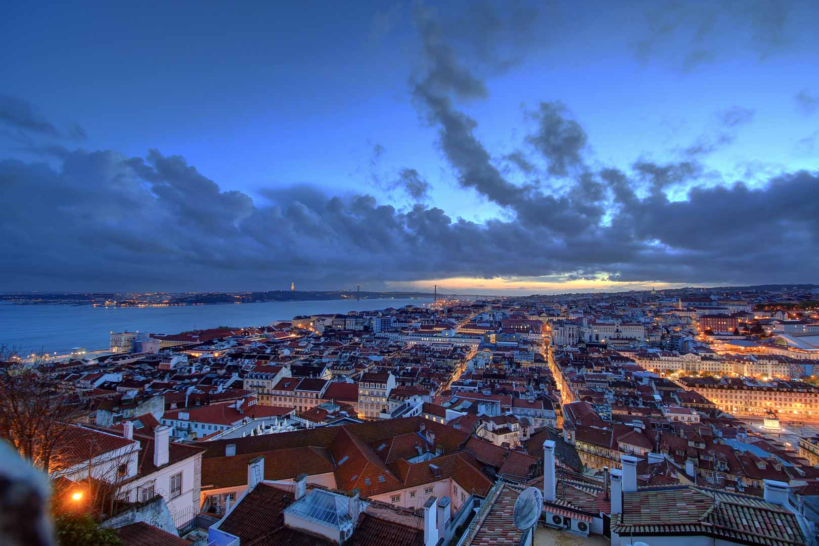 view from the castelo sao jorge right after sunset lisbon