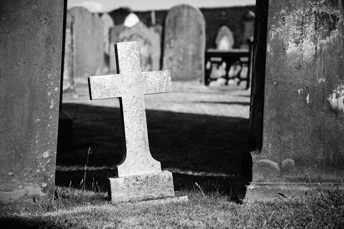 white cross in cemetery