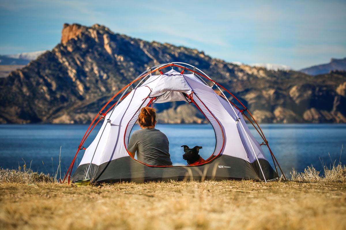 woman and dog in the best dog friendly tents