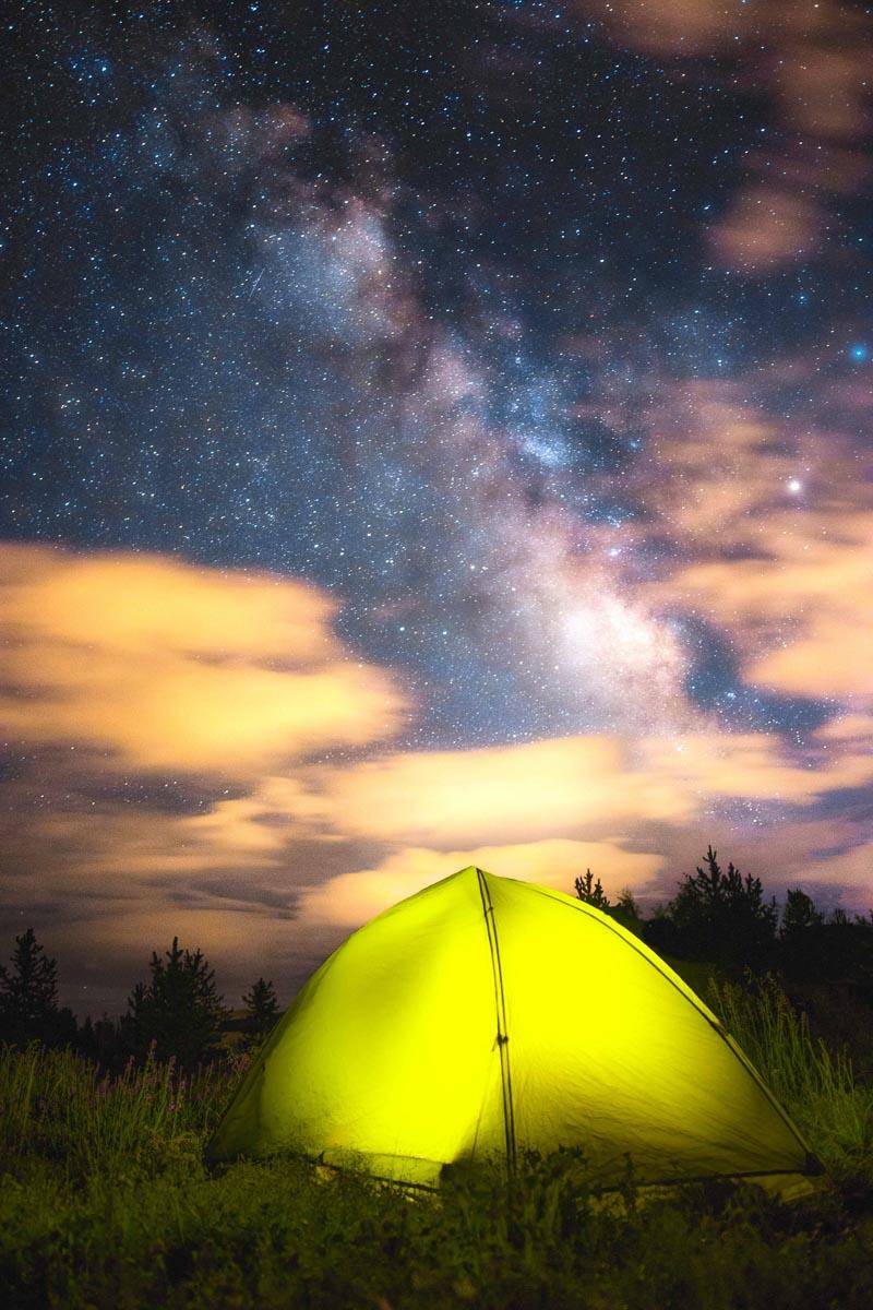 yellow 4 man backpacking tent under the stars