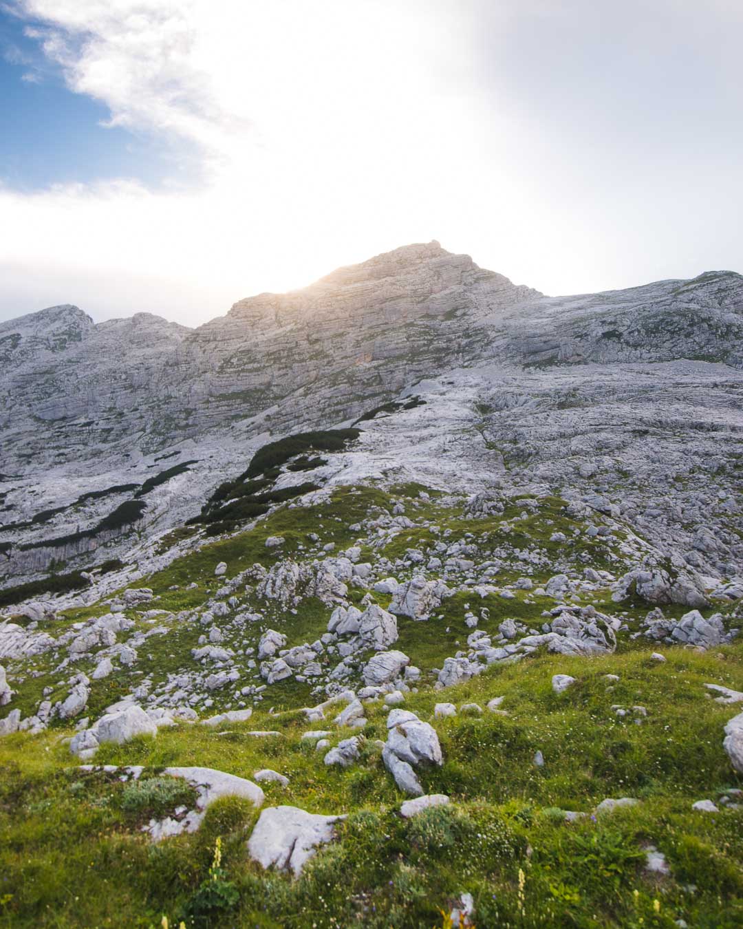 Sun disappearing behind the mountain in Triglav