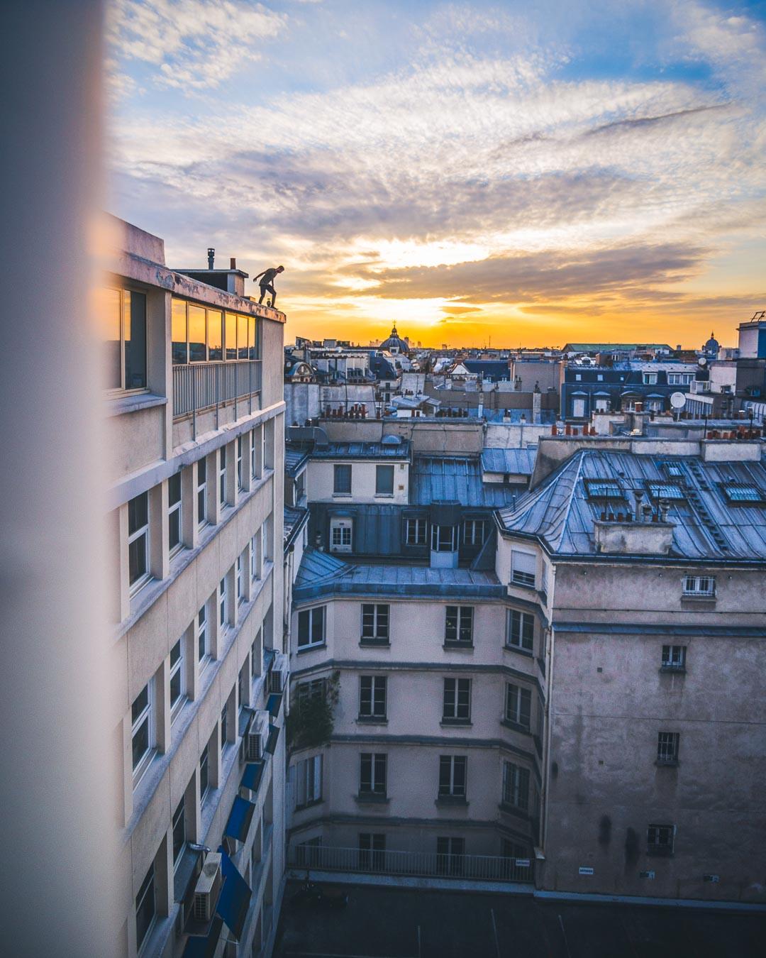 sunset over rooftops with robin