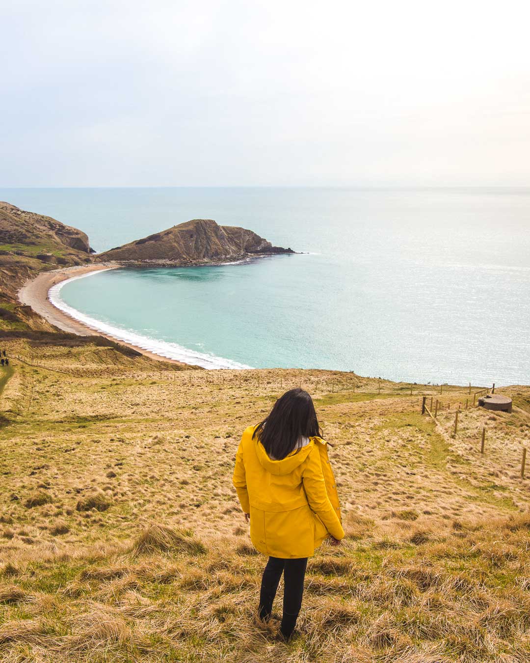 nesrine stopping for the view on the worbarrow bay hike