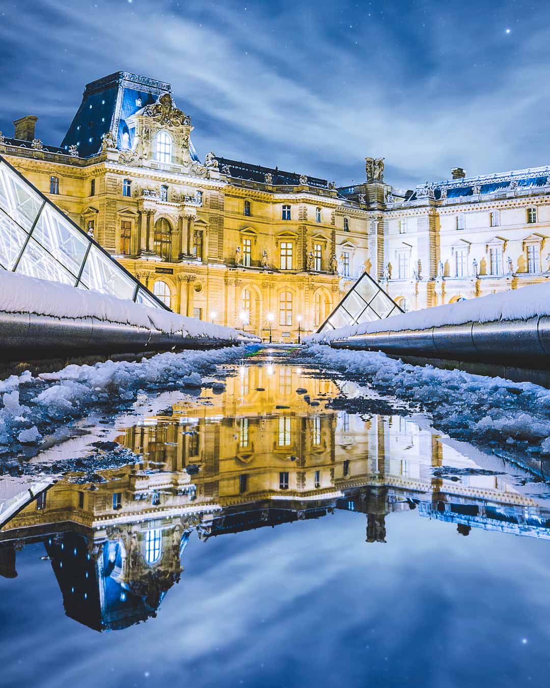 the louvre under snow paris in winter