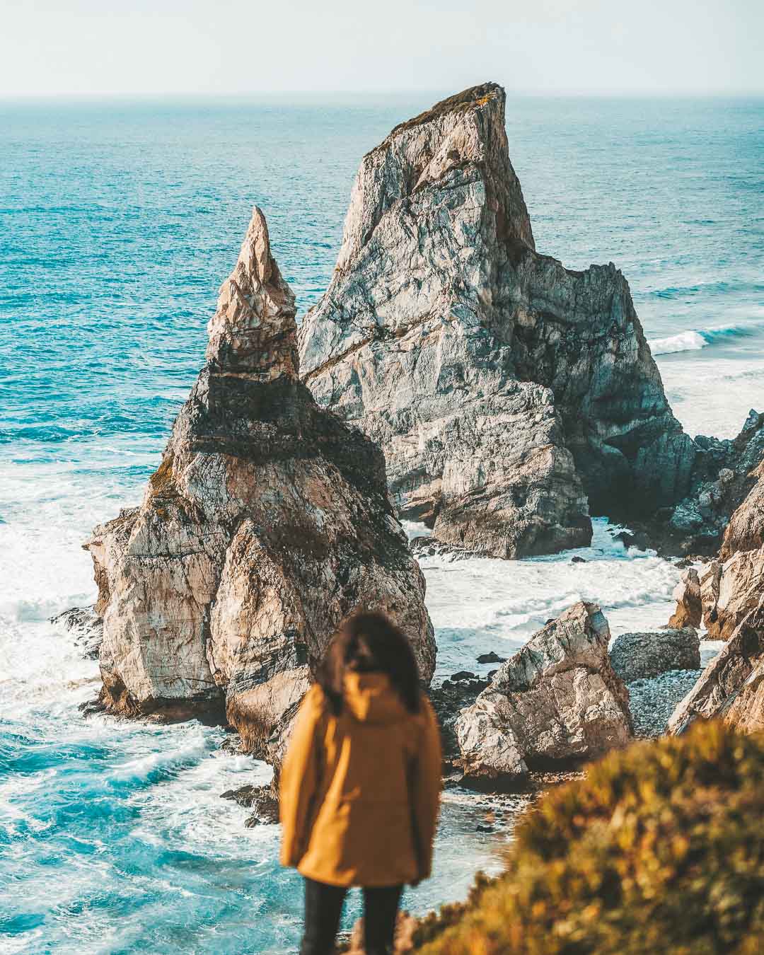 massive sea stacks of praia da ursa