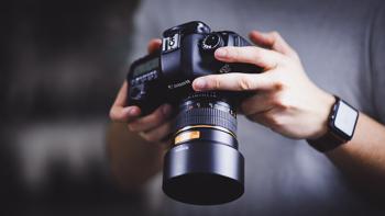 photography gear holding a canon 6d camera