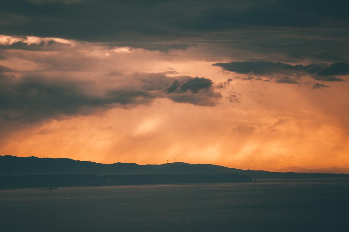 sunset over wind turbines