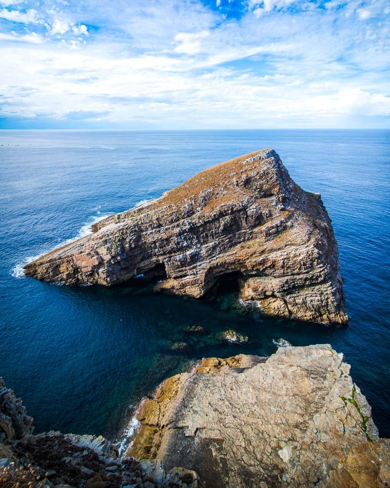 massive rock in the sea at cabo vidio