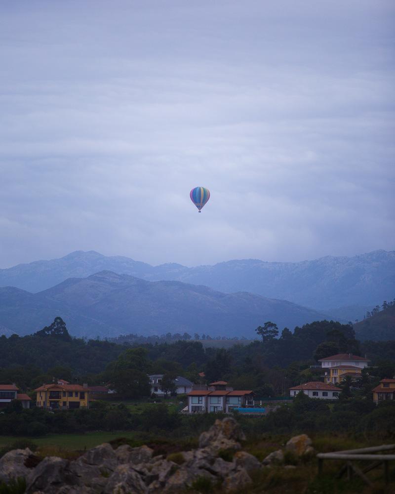 hot air balloon over the mountains