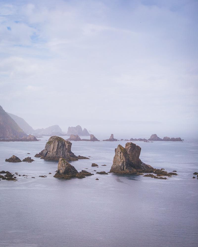 rocks in the sea near playa del silencio