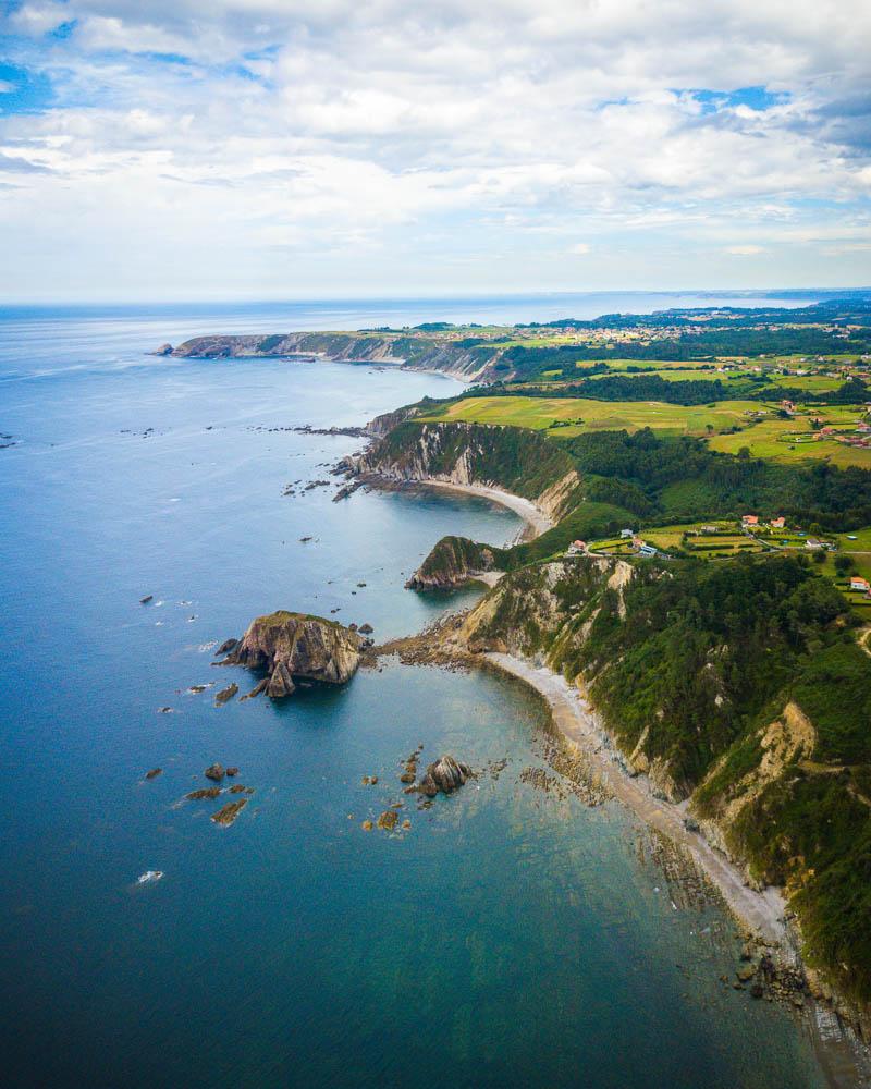 golden beaches seen from the sky in playa del silencio costa verde spain