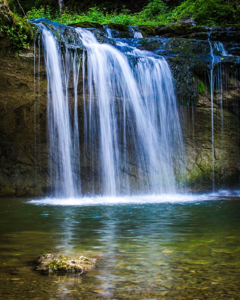 le gour bleu waterfall in cascade du herisson jura