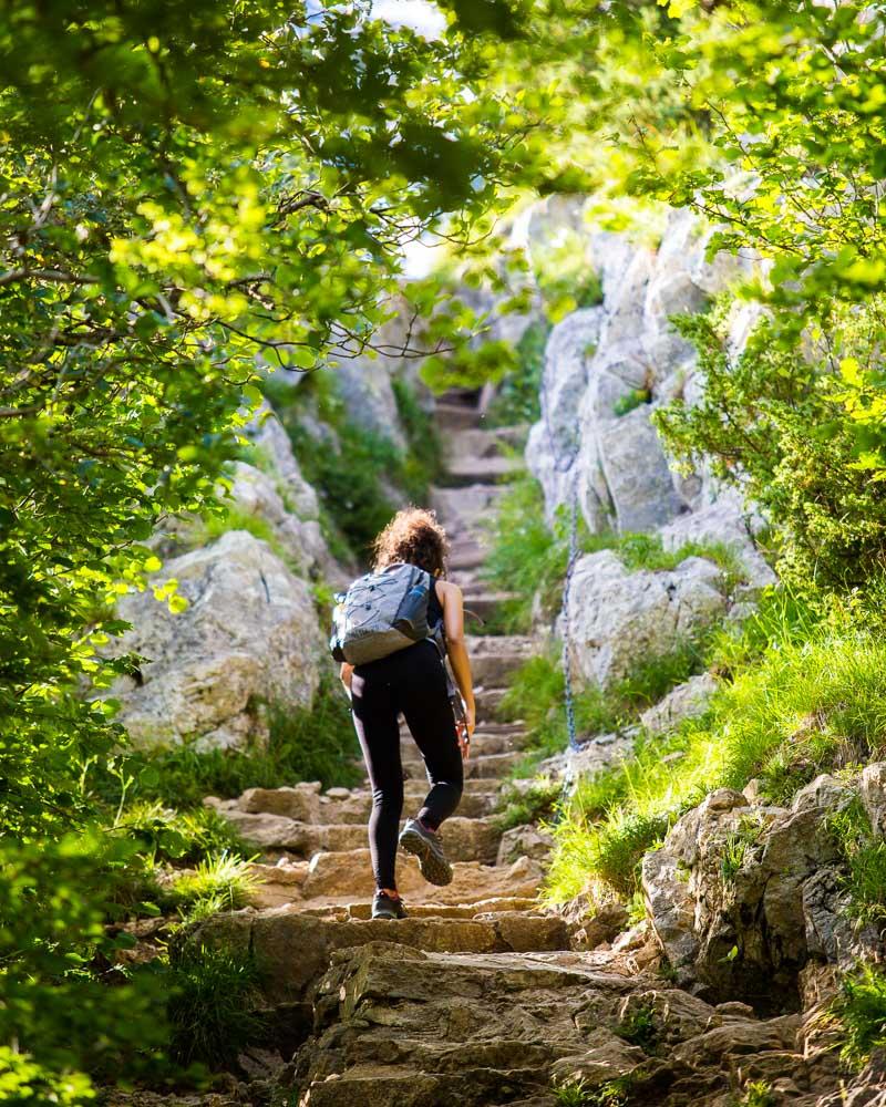 nesrine climbing the stone steps to pic de l'aigle