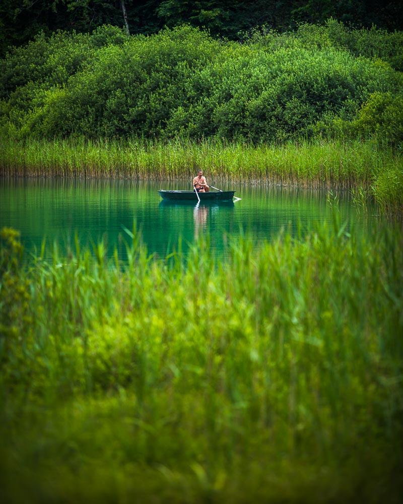 local fisherman in boat on lac de narlay